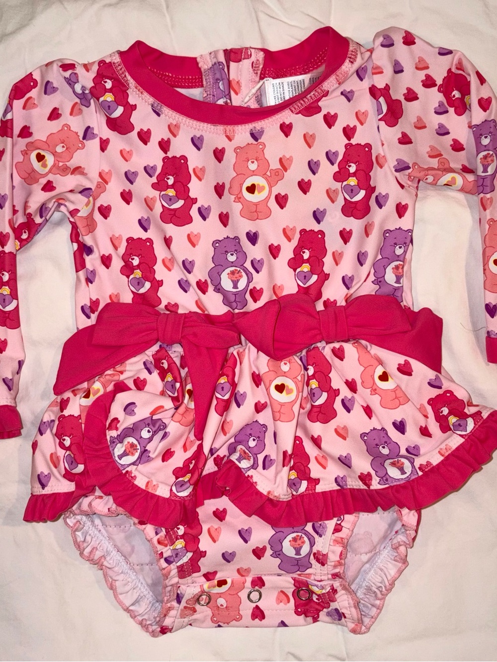 Ruffle Butts X Care Bears 1 piece swimsuit/rashguard sz 18-24 months NWT